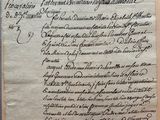 an old document with writing on it sitting on top of a table