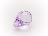 a close up of a purple diamond on a white background
