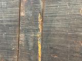 a close up of a piece of wood with rust on it