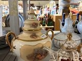 many different types of teapots sitting on a shelf