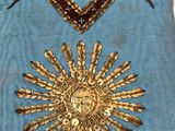 an image of a blue masonic sash with two birds on it