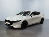 une Mazda blanche à hayon, à hayon, à hayon, à hayon, à hayon, à hayon, à hayon, à hayon, à hayon, à hayon, à hayon, à hayon, à hayon, à hayon, à hayon, à hayon, à hayon