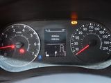 a close up of a car dashboard with a speedometer and gauges