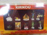a box of miniature figurines that are on display