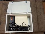 a box that has a laptop in it on the floor
