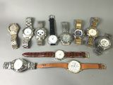 a lot of watches that are sitting on a table