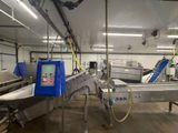 an image of a factory with a conveyor belt and a conveyor belt