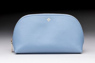 a small blue purse with a gold star on the front