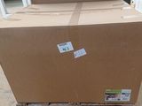 a large cardboard box sitting on a pallet in a warehouse