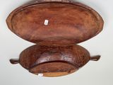 a wooden bowl that has a lid on it