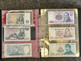 a lot of different bills in a binder on the floor