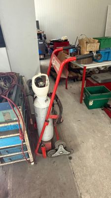 a garage with a lot of tools and equipment in it