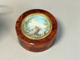 a small wooden box with a picture of a horse on it