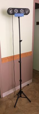 an image of a hair dryer on a stand in the corner of a room