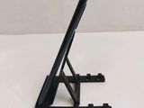 a black tablet on a stand on a white table