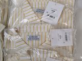 three men ' s white and yellow striped shirts are wrapped in plastic