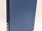 a blue book sitting on top of a white table