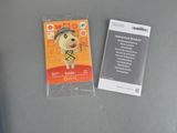 a card with a picture of a dog on it next to a game controller