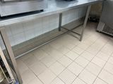 a large stainless steel table in a commercial kitchen