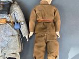 two dolls that are sitting next to each other on a table