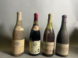 plusieurs bouteilles de vin sont alignées sur une table