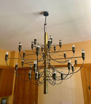 a chandelier that is hanging from the ceiling in a kitchen