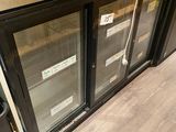 a metal counter top with two glass doors on it