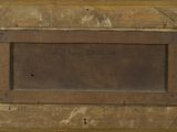 an old picture of a wooden box with a sign on it