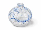glass ornament with blue and white sprinkles on a white background