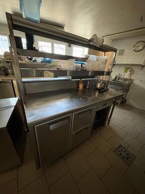 an image of a commercial kitchen with stainless steel counter tops