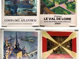 quatre affiches représentant différentes villes sont exposées sur une surface blanche