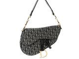 dior saddle bag with monogram print and tassel