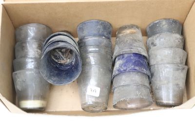 a cardboard box with a bunch of old bottles inside of it