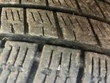 the tire tread of a car is shown on the side of the road