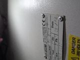 a close up of a white refrigerator with a sticker on it