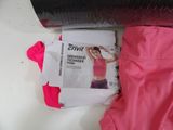 a magazine and a pair of pink pants laying on a table