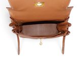 the inside of a brown leather purse with a gold clasp