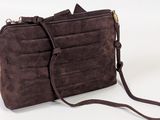 brown sued purse with strap and shoulder strap on white background