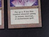 two cards that are sitting on a table