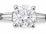 an oval diamond ring with baguets on the shoulders