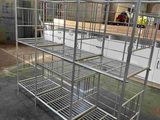 a metal bed in the middle of a warehouse