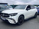 the mercedes gle is parked in a parking lot with other cars