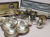 many silver items that are sitting on a table