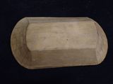 an image of a piece of wood that is laying on a black surface