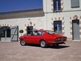 a red car parked in front of a building