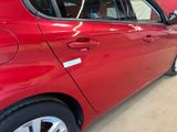 a red car that is parked in a garage