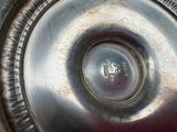 a close up view of a metal object with a hole in the middle