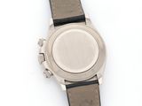 an image of a close up of a wrist watch on a white surface