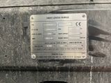 a metal sign on the side of a truck