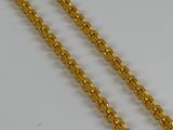 a gold chain on a white background